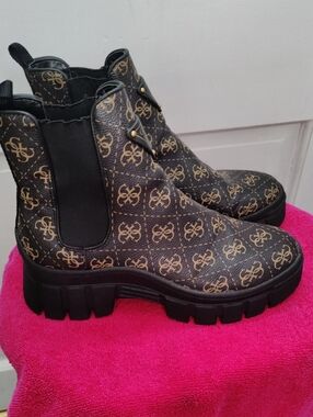 G by Guess Black and Gold Logo Chelsea Lug Boots
